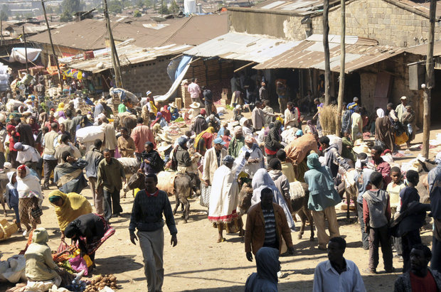 Shoppers buy food at a market in the Ethiopian capital city of Addis Ababa (Associated Press)
